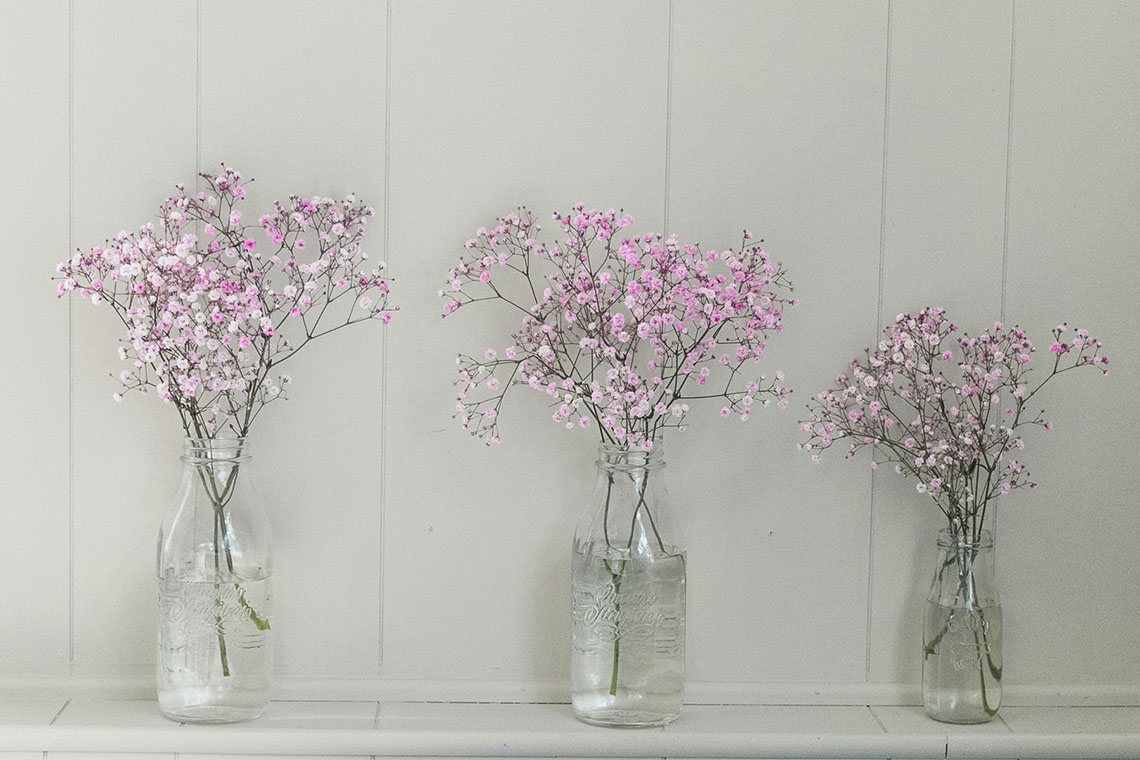 Flowers in glasses - Breathe to Relieve Stress